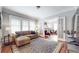 Comfortable living room showcasing French doors, hardwood floors, and natural lighting at 147 Olympic Pl, Decatur, GA 30030