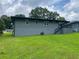 A view of the back of the house and the deck with stairs leading into the backyard at 2107 Garden Cir, Decatur, GA 30032