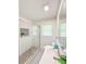 Modern bathroom featuring a glass enclosed shower, white subway tile, and gray hexagonal tile at 2107 Garden Cir, Decatur, GA 30032