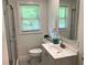 Well-lit bathroom featuring a modern vanity, shower, and contemporary fixtures at 2107 Garden Cir, Decatur, GA 30032