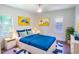 Bright bedroom featuring hardwood floors, a ceiling fan, and a large window with natural light at 2107 Garden Cir, Decatur, GA 30032