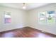 A sunlit bedroom features hardwood floors and bright windows overlooking the yard at 2107 Garden Cir, Decatur, GA 30032
