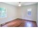 An empty bedroom features hardwood floors and bright windows overlooking the neighborhood at 2107 Garden Cir, Decatur, GA 30032