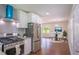 Open kitchen with stainless steel appliances and an adjacent dining area at 2107 Garden Cir, Decatur, GA 30032