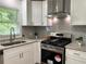 Updated kitchen features granite countertops and stainless steel appliances at 2107 Garden Cir, Decatur, GA 30032