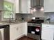 Updated kitchen features stainless steel appliances and granite countertops at 2107 Garden Cir, Decatur, GA 30032