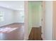 A bright living room has hardwood floors and a view of another room at 2107 Garden Cir, Decatur, GA 30032