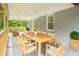 Cozy, covered porch with outdoor seating and a dining table at 2107 Garden Cir, Decatur, GA 30032