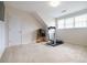 Bonus room with carpet flooring, fitness equipment, and natural light for recreation or hobbies at 1997 Shaker Falls Ln, Lawrenceville, GA 30045