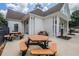 Community clubhouse with picnic tables and manicured landscaping, ideal for gatherings and outdoor enjoyment at 1997 Shaker Falls Ln, Lawrenceville, GA 30045