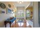 Elegant entryway with hardwood floors, wainscoting, and decorative wall accents at 1997 Shaker Falls Ln, Lawrenceville, GA 30045