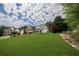 Well-kept home with a sprawling front yard, mature trees, and tasteful landscaping at 1997 Shaker Falls Ln, Lawrenceville, GA 30045