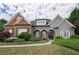 Charming two-story home with manicured landscaping and a welcoming front entrance at 1997 Shaker Falls Ln, Lawrenceville, GA 30045