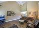 Vaulted ceiling living room with a fireplace, large windows and comfortable furniture at 1997 Shaker Falls Ln, Lawrenceville, GA 30045