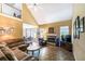 Spacious living room with a stone fireplace, high ceilings, and an adjoining dining area at 1997 Shaker Falls Ln, Lawrenceville, GA 30045