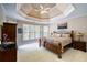 Tranquil main bedroom with tray ceilings, soft lighting, and large windows at 1997 Shaker Falls Ln, Lawrenceville, GA 30045