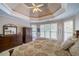 Inviting main bedroom with a trey ceiling and neutral color palette at 1997 Shaker Falls Ln, Lawrenceville, GA 30045