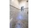 Beautiful tiled walk-in shower with bench, niche, and pebble flooring, providing a spa-like experience at 1997 Shaker Falls Ln, Lawrenceville, GA 30045