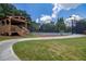 Community tennis court with a gazebo and well-maintained landscaping, encouraging an active lifestyle at 1997 Shaker Falls Ln, Lawrenceville, GA 30045