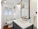 Modern bathroom featuring a marble countertop, updated fixtures, and stylish design at 2481 Melinda Ne Dr, Atlanta, GA 30345