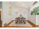 Dining room with hardwood floors, modern chandelier, and decoratively framed art at 2481 Melinda Ne Dr, Atlanta, GA 30345