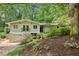 Charming exterior elevation of a two-story home with landscaped front yard and attached garage at 2481 Melinda Ne Dr, Atlanta, GA 30345