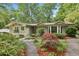Home featuring excellent landscaping, a brick walkway, and updated architectural elements at 2481 Melinda Ne Dr, Atlanta, GA 30345
