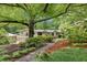 Beautiful home with mature trees and landscape, highlighted by a stone walkway at 2481 Melinda Ne Dr, Atlanta, GA 30345