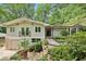 Inviting home exterior with a well-manicured lawn, beautiful foliage, and a charming balcony at 2481 Melinda Ne Dr, Atlanta, GA 30345
