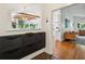 Foyer featuring dark wood flooring, contemporary decor, and a view into the living spaces at 2481 Melinda Ne Dr, Atlanta, GA 30345