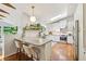 Well-lit kitchen featuring modern cabinetry, granite countertops, stainless steel appliances, and a breakfast bar at 2481 Melinda Ne Dr, Atlanta, GA 30345