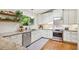 Modern kitchen featuring stainless steel appliances, a tiled backsplash, and wooden accents at 2481 Melinda Ne Dr, Atlanta, GA 30345