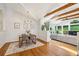 Open concept living space with hardwood floors, beamed ceilings, and an abundance of natural light at 2481 Melinda Ne Dr, Atlanta, GA 30345
