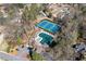 Aerial view of community amenities including tennis courts and a pool surrounded by trees at 4333 Collingham Ne Trce, Marietta, GA 30068