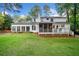 Expansive backyard with a deck, screened-in porch, and sunroom, perfect for outdoor living at 4333 Collingham Ne Trce, Marietta, GA 30068
