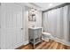 Bathroom with gray vanity, mirror, and shower/tub combo with patterned shower curtain at 4333 Collingham Ne Trce, Marietta, GA 30068