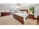 Spacious bedroom with dark wood furniture, ceiling fan, and natural light for comfortable living at 4333 Collingham Ne Trce, Marietta, GA 30068