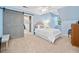 Airy bedroom with blue walls, white trim, and a sliding barn door at 4333 Collingham Ne Trce, Marietta, GA 30068