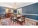 Sophisticated dining room with blue walls, hardwood floors, and a stylish chandelier at 4333 Collingham Ne Trce, Marietta, GA 30068
