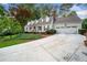 Charming home with manicured lawn, white siding, dormer windows, and a spacious driveway at 4333 Collingham Ne Trce, Marietta, GA 30068
