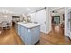 Well designed kitchen with a barn door, stainless steel refrigerator, and center island at 4333 Collingham Ne Trce, Marietta, GA 30068
