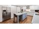 Modern kitchen with stainless steel appliances, center island with seating, and ample counter space at 4333 Collingham Ne Trce, Marietta, GA 30068