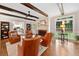 Cozy living room with a fireplace, beamed ceilings, and plenty of natural light from large windows at 4333 Collingham Ne Trce, Marietta, GA 30068