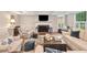 Comfortable living room featuring a fireplace, hardwood floors, and soft, natural lighting at 4333 Collingham Ne Trce, Marietta, GA 30068