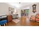 Home office setup with hardwood floors and view into a dining room with stylish chandelier at 4333 Collingham Ne Trce, Marietta, GA 30068