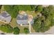 Bird's eye view of a home with a stone patio, deck, and walkway surrounded by mature trees at 735 River Ridge Ln, Suwanee, GA 30024