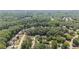 Lush neighborhood from above, with tree-lined streets and well-maintained homes creating a serene environment at 735 River Ridge Ln, Suwanee, GA 30024