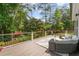 Inviting back deck with comfortable seating, perfect for outdoor relaxation and entertaining at 735 River Ridge Ln, Suwanee, GA 30024