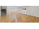 Spacious finished basement with wood floors, staircase, and access to the outside at 735 River Ridge Ln, Suwanee, GA 30024