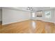 Large basement with hardwood floors, recessed lighting, and a convenient wet bar at 735 River Ridge Ln, Suwanee, GA 30024
